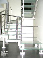 Two stepped string staircase with glass stair