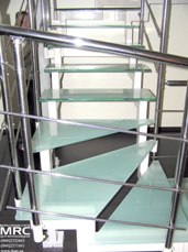 Baluster from polished stainless steel and glass stairs
