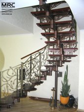 Spiral staircase with forged balusters