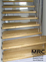 Stair with bolts. Stages from the array of oak, protection from stainless steel