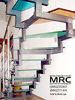 Metal construction of staircase with coloured stages from glass triplex