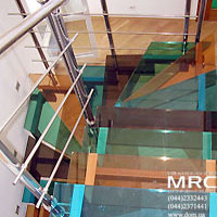 Coloured stages from glass triplex and with baluster from polished stainless steel