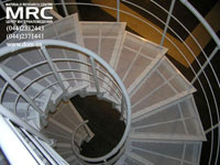 Metalic stages in powder-like painting of spiral staircase