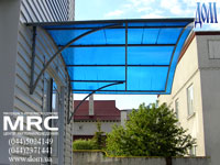 Porte-cochere from tinted light absorpsion polycarbonate