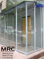 Pendulum glass door and glass walls as a part of glass entrance lobby